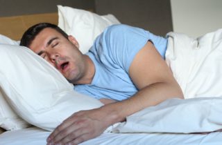 Man snoring while sleeping with sleep apnea dentist Poquoson Virginia